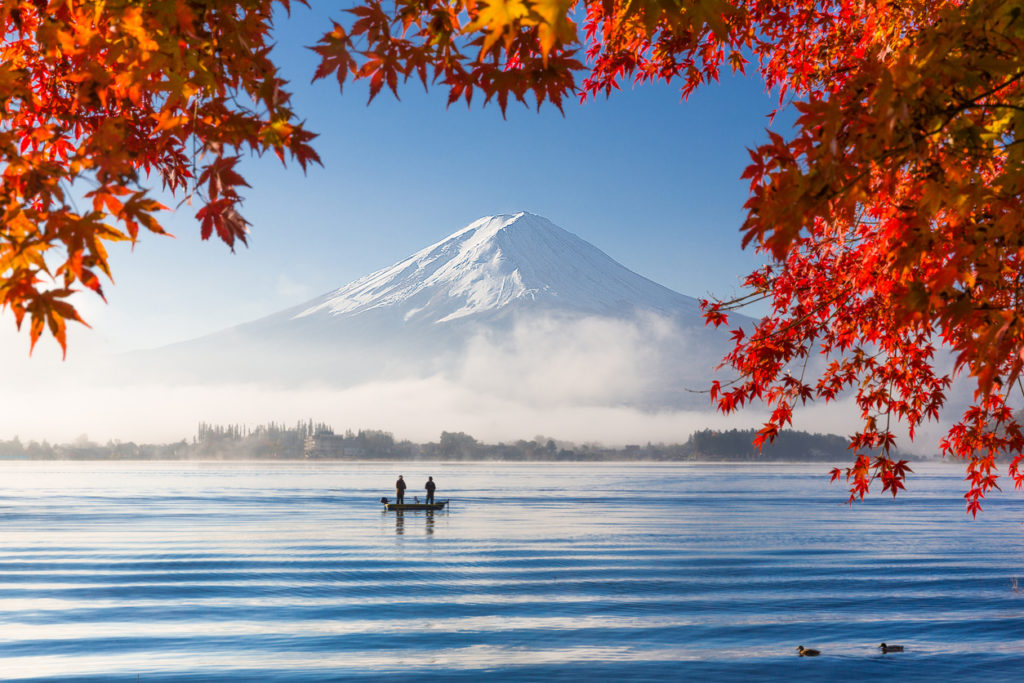 Mountain Fuji and lake with morning fog in autumn season