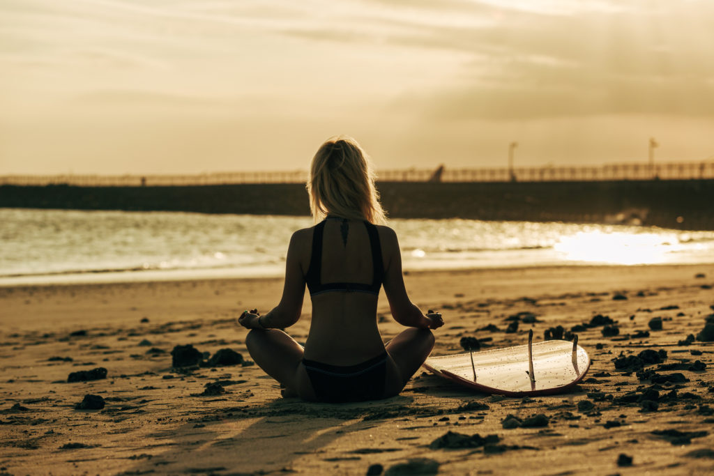 Meditating before surfing