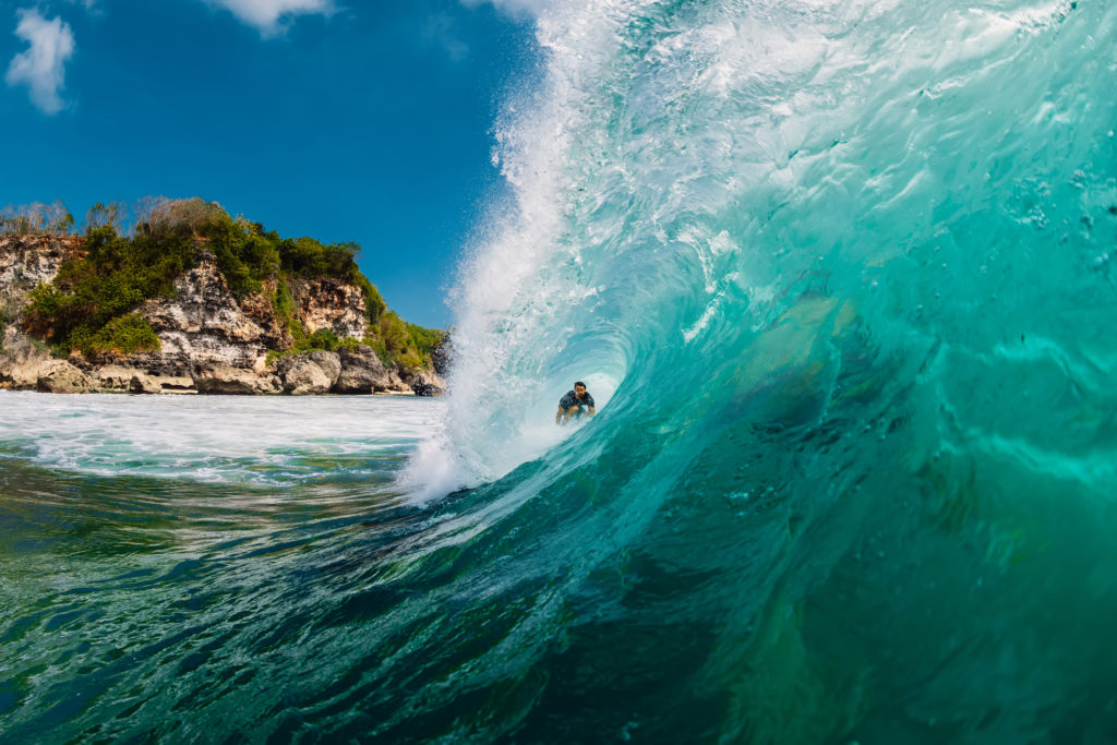 Surfer riding a natural barrel